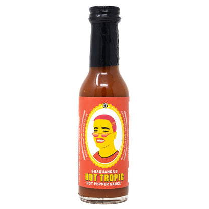 Bottle of Shaquanda's Hot Tropic hot pepper sauce on a white background