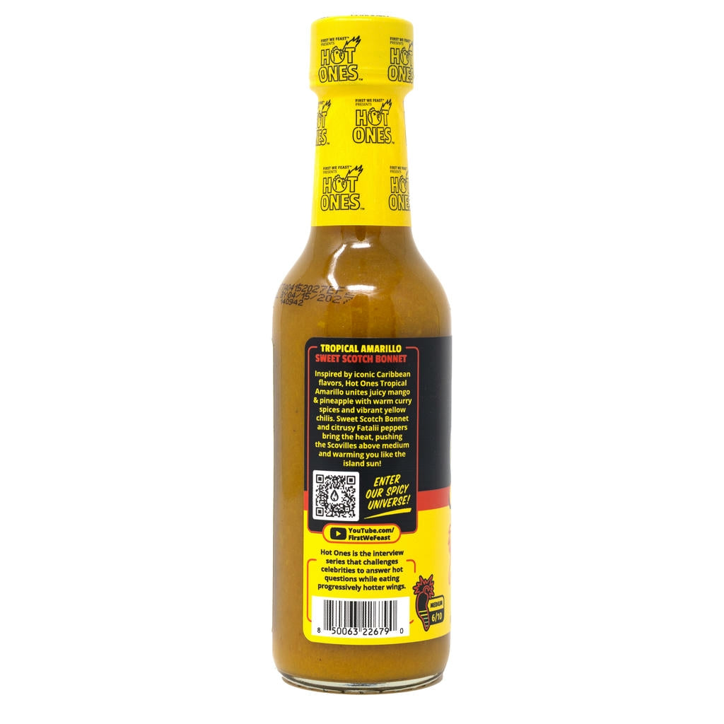 Hot Ones hot sauce bottle with yellow cap and label on a white background